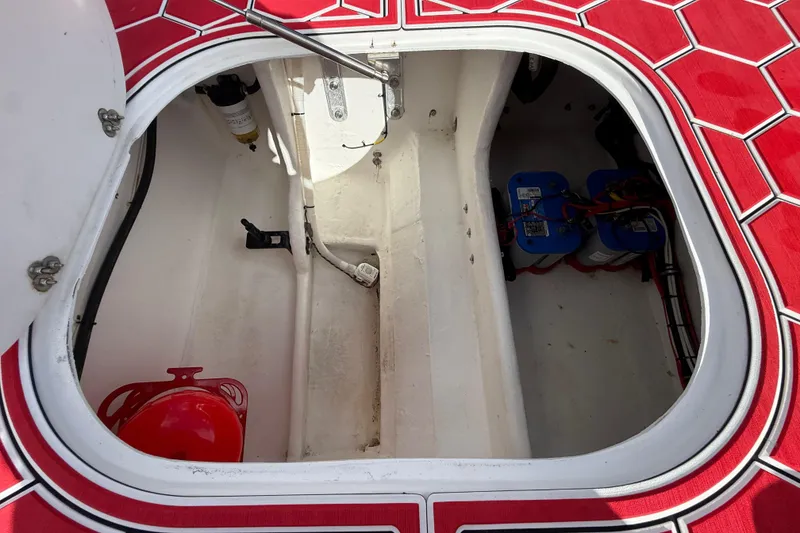 Slide: The Image of Open hatch of 2020 HellKats 30 boat showing interior components and wiring. - 51