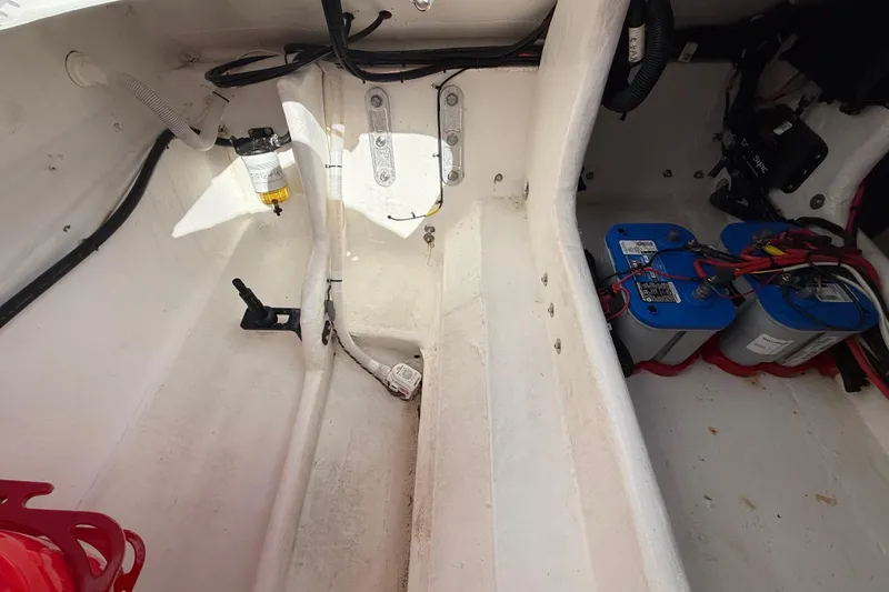 Slide: The Image of Interior of a 2020 HellKats 30 boat showing battery compartment and wiring. - 52