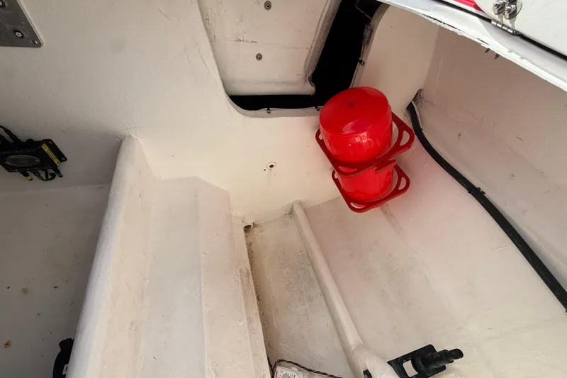 Slide: The Image of Interior of a 2020 HellKats 30 boat with red safety equipment. - 53
