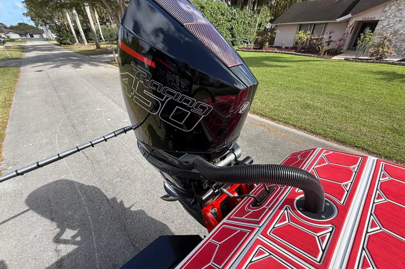 Slide: The Image of HellKats 30 boat with Racing 450 engine, parked on a residential street, 2020 model. - 58