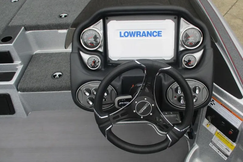 Slide: The Image of Dashboard of 2026 Triton 19 TrX Patriot boat with Lowrance display. - 4