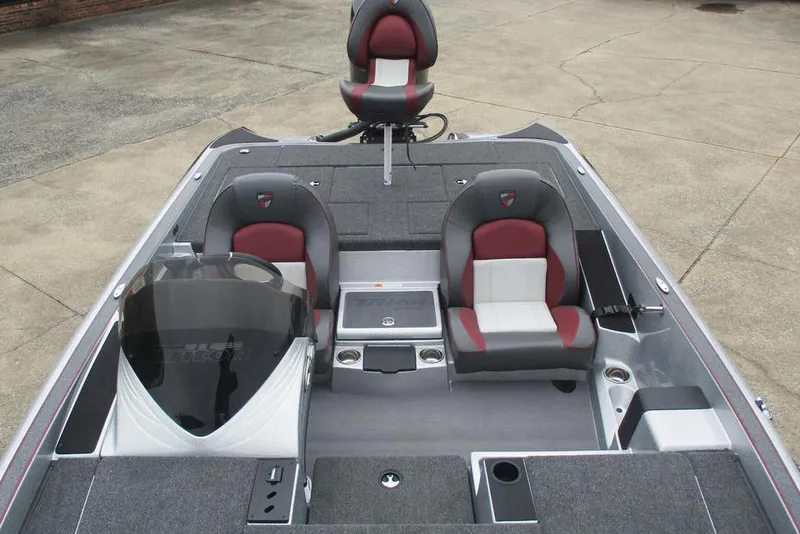 Slide: The Image of 2026 Triton 19 TrX Patriot boat interior with dual seats and console. - 5