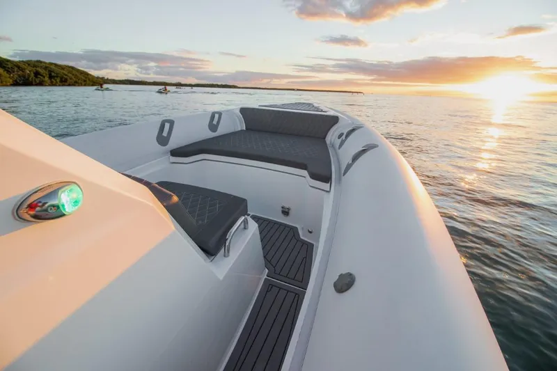 Slide: The Image of 2024 Northstar Orion 8 boat at sunset on calm waters. - 13