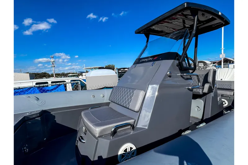 Slide: The Image of 2024 Northstar Orion 8 boat with sleek design and modern seating under a clear blue sky. - 8