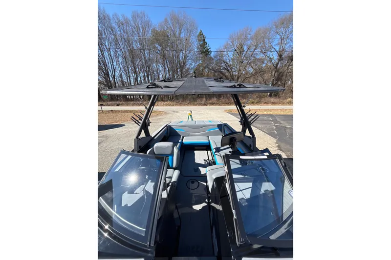 Slide: The Image of 2023 Axis T220 boat with open cockpit, sleek design, and modern features. - 18