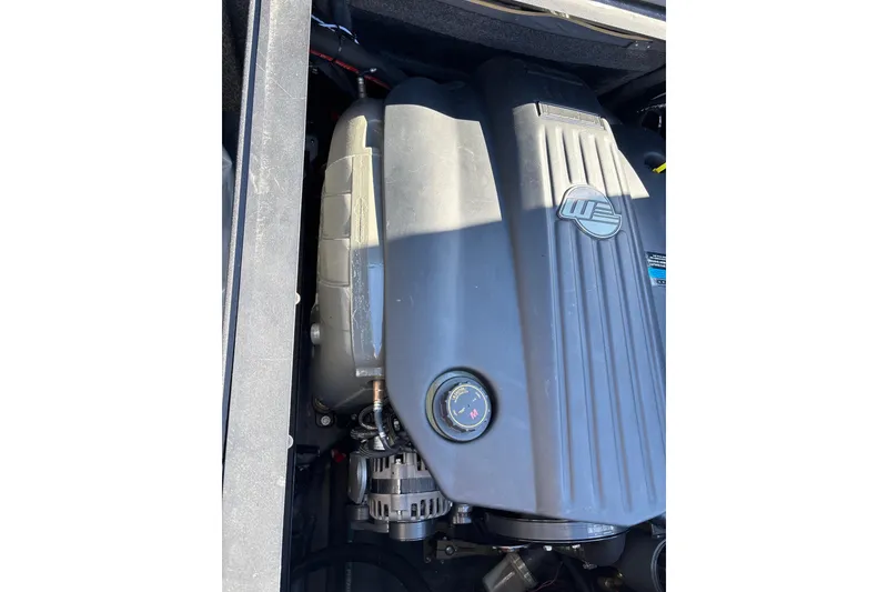 Slide: The Image of 2023 Axis T220 engine compartment with visible components and branding. - 27