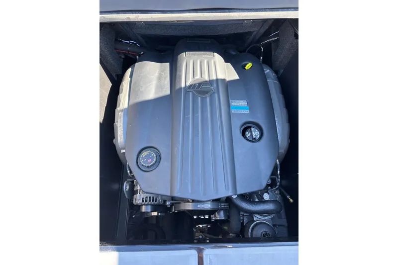 Slide: The Image of 2023 Axis T220 engine compartment, showcasing a powerful inboard motor. - 28