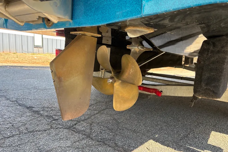 Slide: The Image of 2023 Axis T220 boat propeller and rudder detail on pavement. - 29