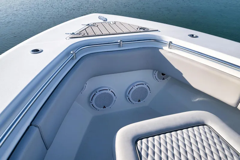 Slide: The Image of 2021 Contender 39 ST boat interior with speakers and cushioned seating. - 11