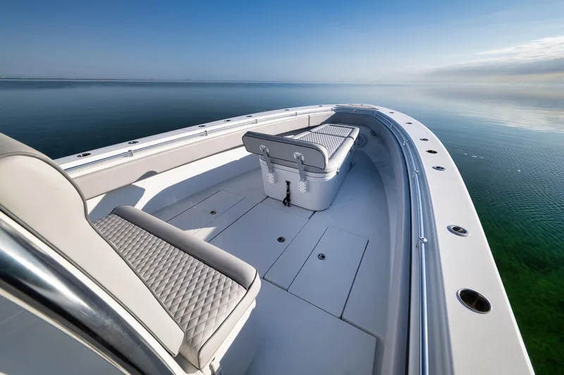 Slide: The Image of 2021 Contender 39 ST boat with sleek seating on calm water. - 12