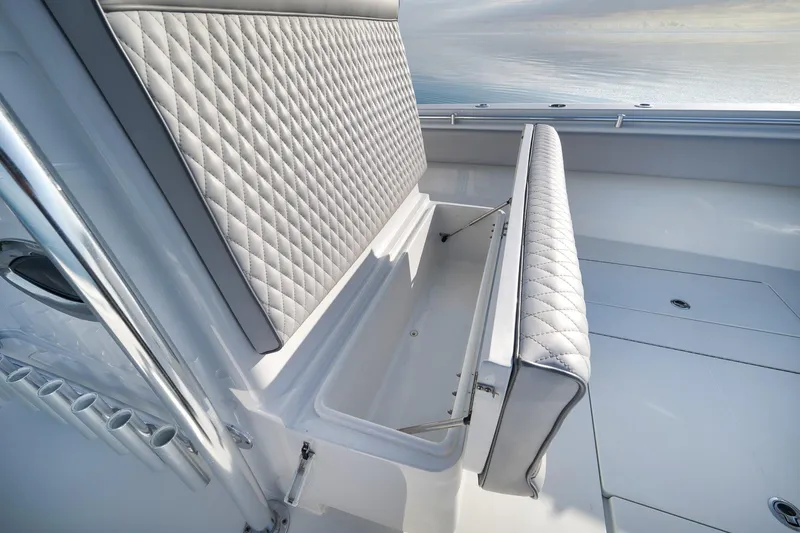 Slide: The Image of 2021 Contender 39 ST boat with diamond-stitched seating and storage compartment. - 15