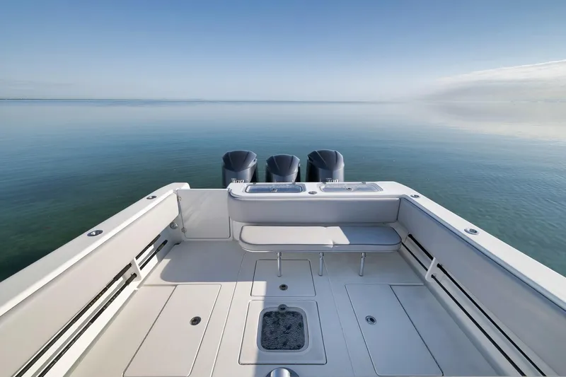 Slide: The Image of 2021 Contender 39 ST boat with triple engines on calm water. - 22