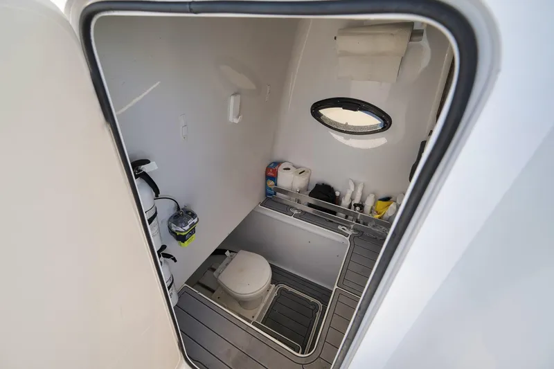Slide: The Image of 2021 Contender 39 ST boat interior cabin with toilet and storage. - 28