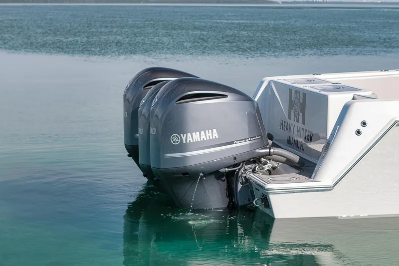 Slide: The Image of 2021 Contender 39 ST boat with Yamaha outboard engines in calm water. - 31