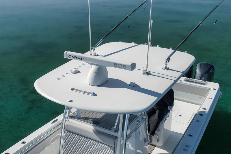 Slide: The Image of 2021 Contender 39 ST boat with Garmin radar, aerial view on clear water. - 32