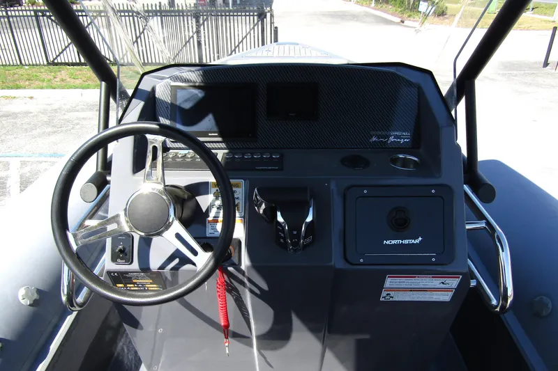 Slide: The Image of 2024 Northstar Orion 8 boat dashboard with steering wheel and control panel. - 18