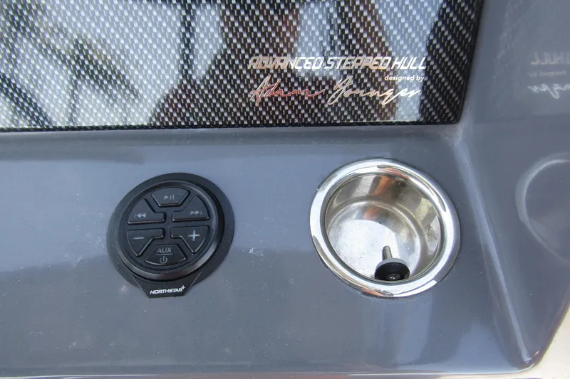 Slide: The Image of Control panel of 2024 Northstar Orion 8 with audio controls and cup holder. - 22