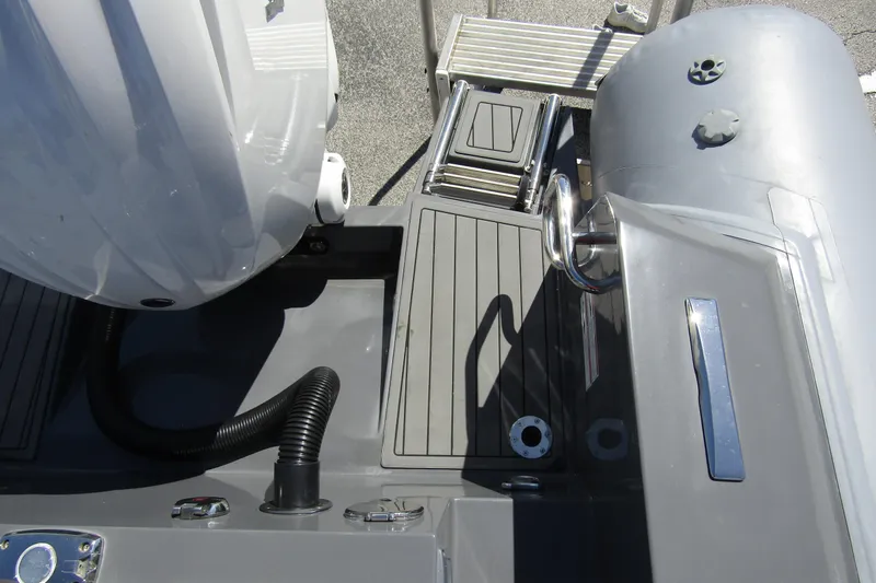 Slide: The Image of 2024 Northstar Orion 8 boat deck with motor and ladder, showcasing sleek design. - 28