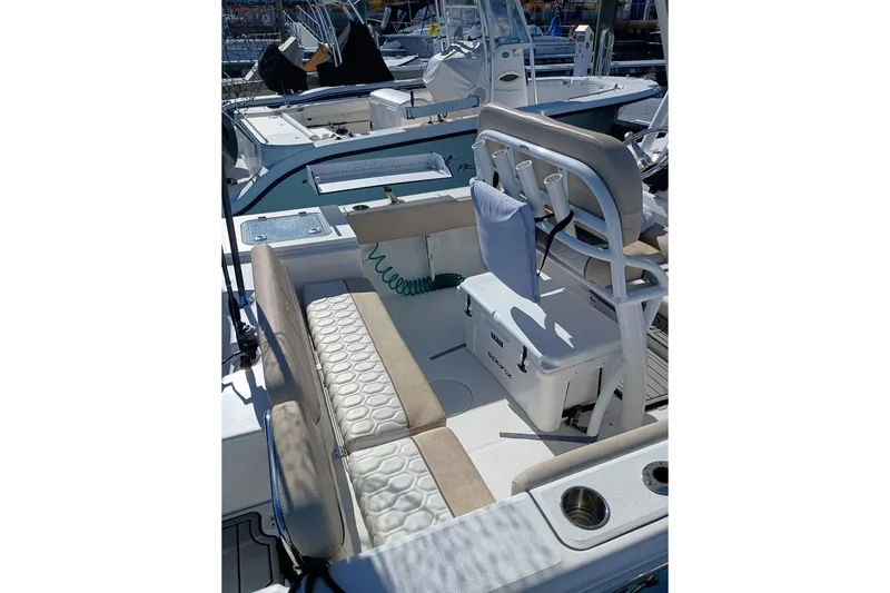 Slide: The Image of 2021 Sea Fox 228 Commander boat interior with seating and storage features. - 9
