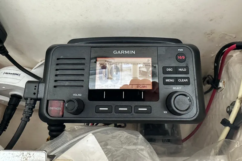 Slide: The Image of Garmin marine radio on 2023 Grady-White Fisherman 257 boat dashboard. - 11