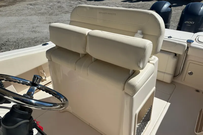 Slide: The Image of 2023 Grady-White Fisherman 257 boat interior with steering wheel and seating. - 13