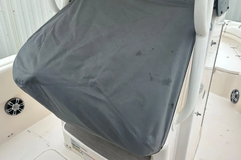 Slide: The Image of 2023 Grady-White Fisherman 257 boat with covered console and visible speaker. - 18