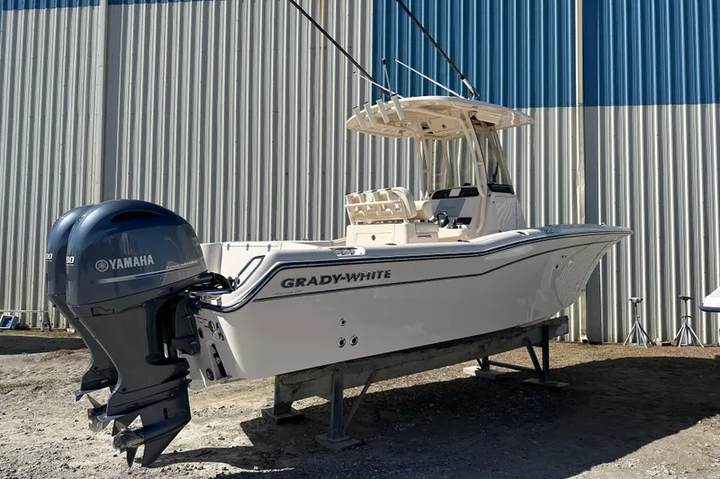 Slide: The Image of 2023 Grady-White Fisherman 257 boat with Yamaha engines, displayed outdoors. - 3