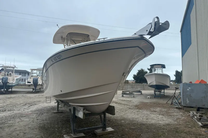 Slide: The Image of 2023 Grady-White Fisherman 257 boat on dry dock, side view. - 4