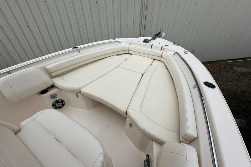 Slide: The Image of 2023 Grady-White Fisherman 257 boat interior with white cushioned seating. - 8