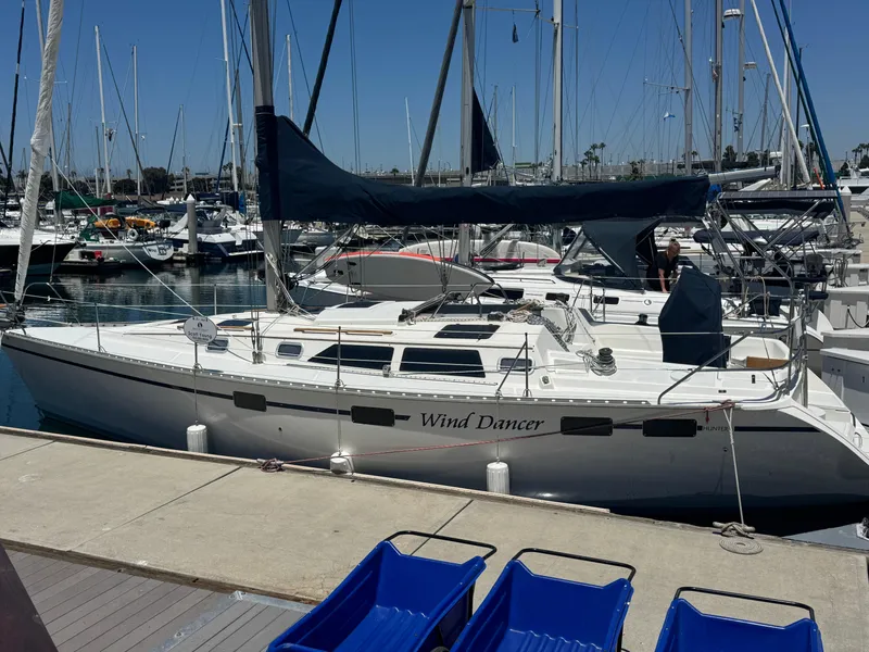 The Image of Hunter Legend 375 sailboat, 1992 model, named "Wind Dancer" docked at a marina. - 0