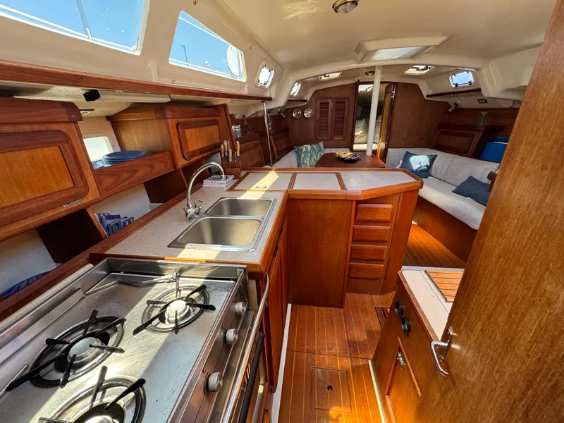 Slide: The Image of Interior of 1992 Hunter Legend 375 sailboat with kitchen and seating area. - 27