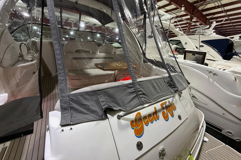 Slide: The Image of 2005 Sea Ray 360 Sundancer yacht with covered seating area in marina. - 15