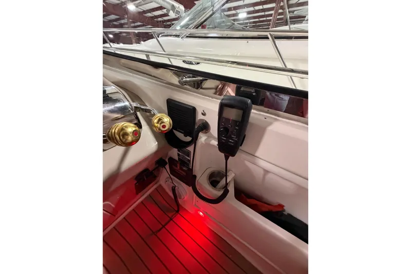 Slide: The Image of 2005 Sea Ray 360 Sundancer helm with controls and communication device. - 26