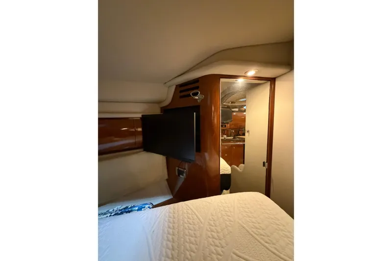Slide: The Image of Interior cabin of 2005 Sea Ray 360 Sundancer with TV and cozy bedding. - 32
