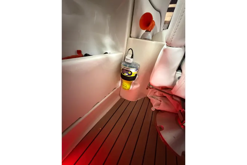 Slide: The Image of 2005 Sea Ray 360 Sundancer interior with safety equipment and wooden flooring. - 37