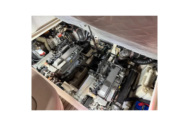 Slide: The Image of Engine compartment of a 2005 Sea Ray 360 Sundancer boat, showcasing dual engines. - 38