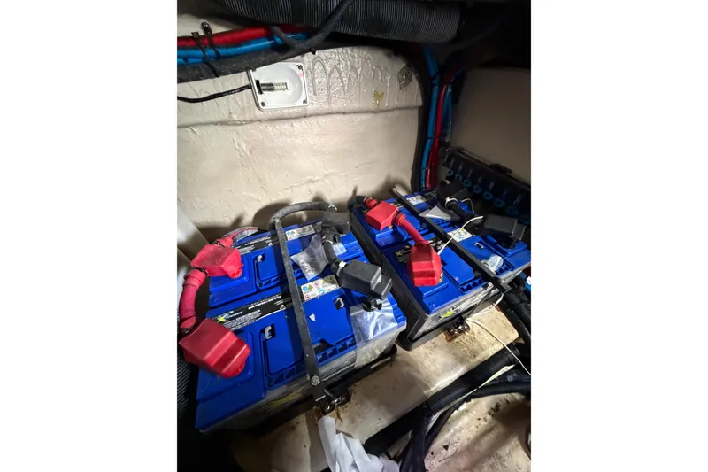 Slide: The Image of Batteries in the engine compartment of a 2005 Sea Ray 360 Sundancer boat. - 39