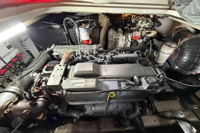 Slide: The Image of Engine compartment of a 2005 Sea Ray 360 Sundancer boat, showcasing detailed machinery. - 43