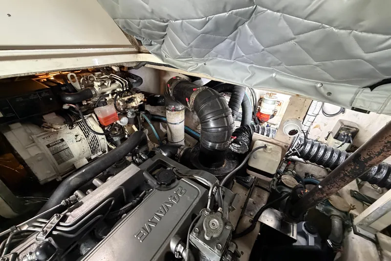 Slide: The Image of Engine room of a 2005 Sea Ray 360 Sundancer, showcasing mechanical components and systems. - 44