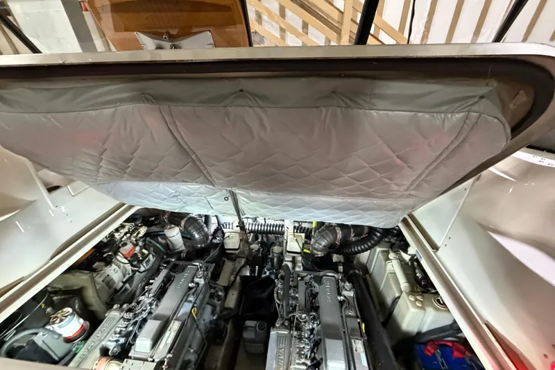 Slide: The Image of Engine compartment of a 2005 Sea Ray 360 Sundancer boat, showing dual engines. - 46