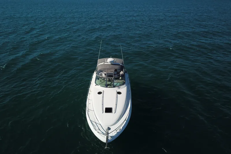 Slide: The Image of 2005 Sea Ray 360 Sundancer yacht cruising on open water, aerial view. - 5