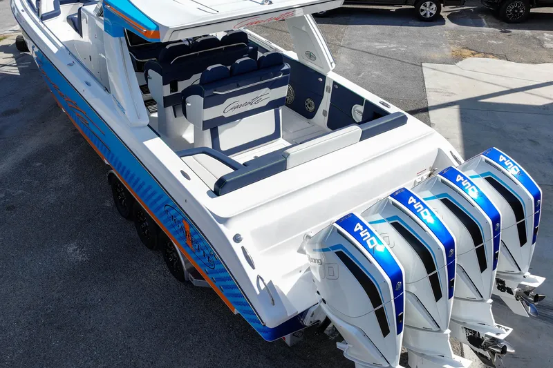Slide: The Image of 2023 Cigarette 41' Nighthawk boat with quad outboard engines, sleek design, and spacious seating. - 3