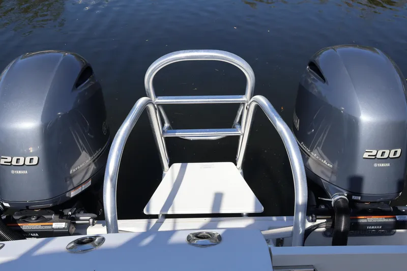 Slide: The Image of 2022 World Cat 280 CC-X boat with dual Yamaha 200 engines on water. - 10