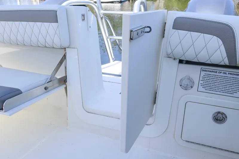 Slide: The Image of 2022 World Cat 280 CC-X boat interior with open door and seating area. - 12