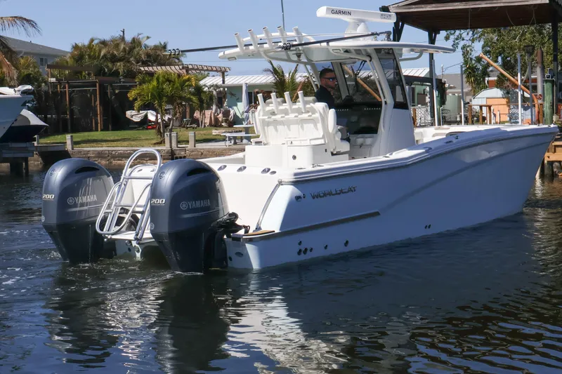 Slide: The Image of 2022 World Cat 280 CC-X boat with twin Yamaha engines on the water. - 2