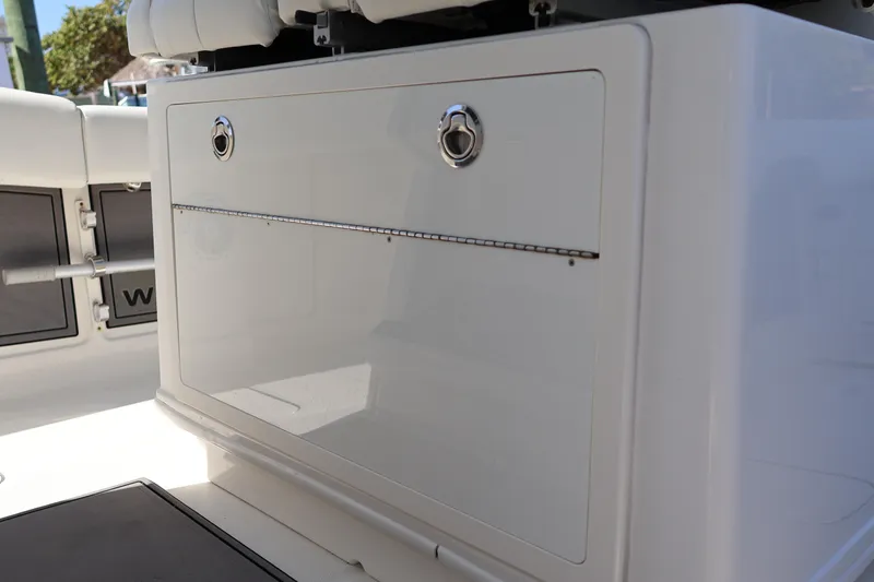 Slide: The Image of 2022 World Cat 280 CC-X boat storage compartment with sleek design and secure latches. - 25
