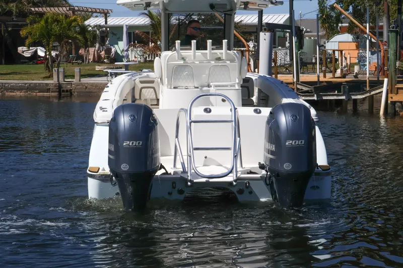 Slide: The Image of 2022 World Cat 280 CC-X boat with dual Yamaha 200 engines on water. - 3