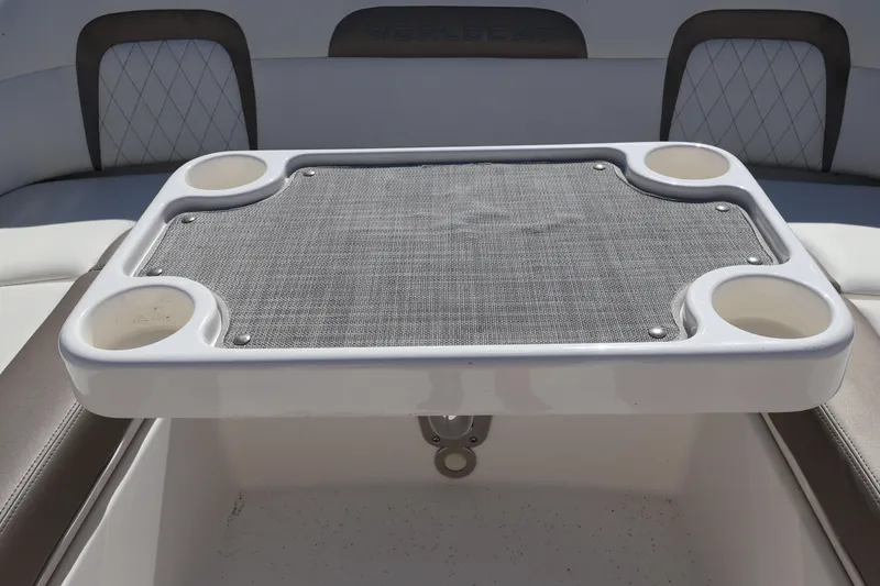 Slide: The Image of 2022 World Cat 280 CC-X boat table with cup holders and mesh surface. - 40
