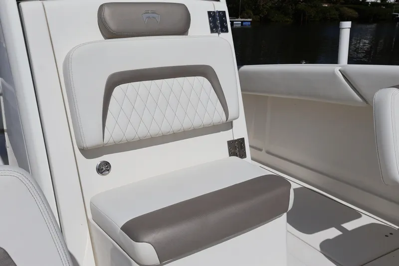 Slide: The Image of Luxurious seating on 2022 World Cat 280 CC-X boat, featuring elegant upholstery design. - 44