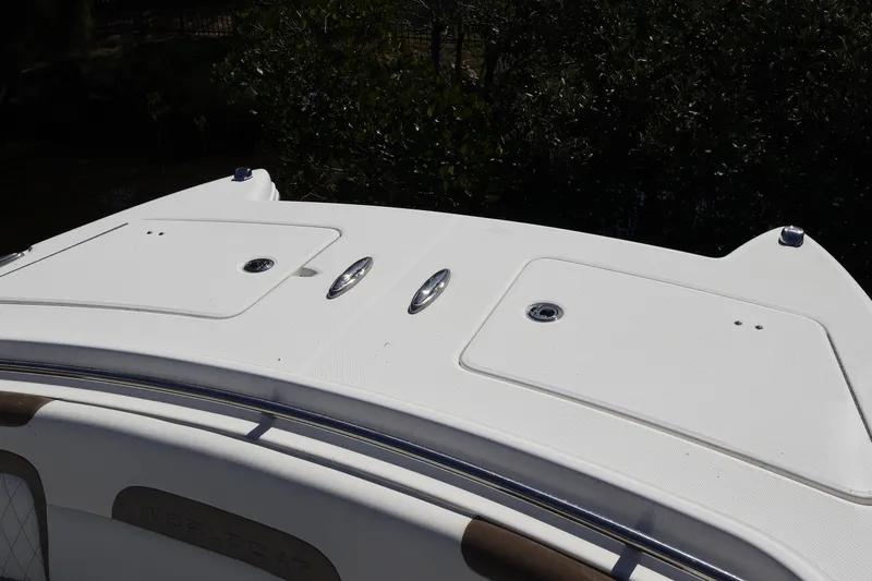 Slide: The Image of 2022 World Cat 280 CC-X boat deck with storage compartments and sleek design. - 48